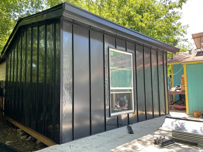 Black standing seam metal wall panels for Roof Inspection in Archer Lodge